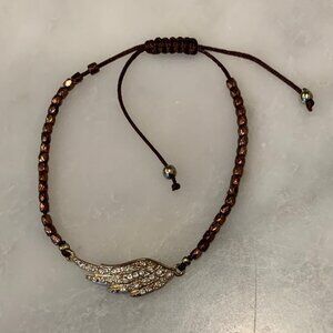 Beaded bracelet with wing charm